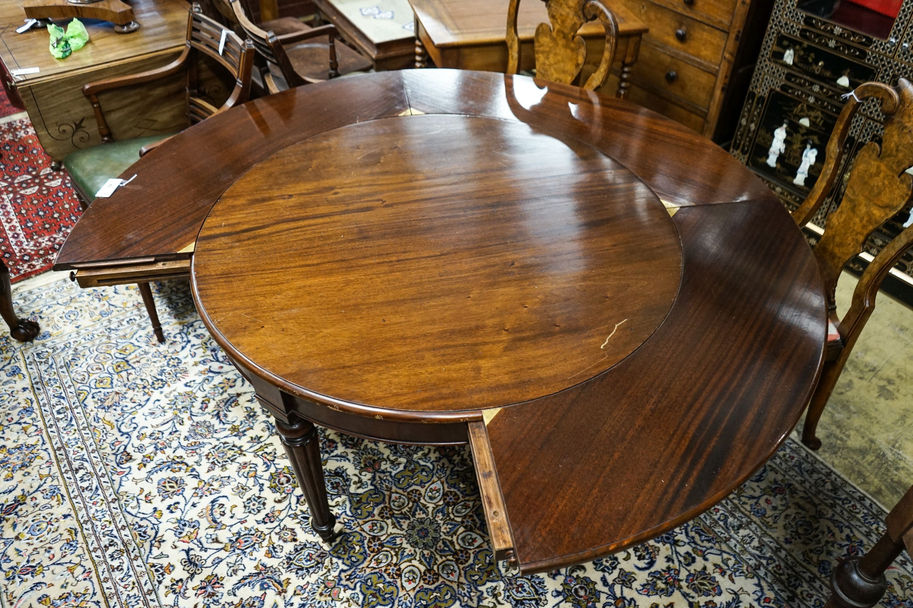 A Victorian and later circular mahogany extending dining table, 170cm diameter, height 70cm